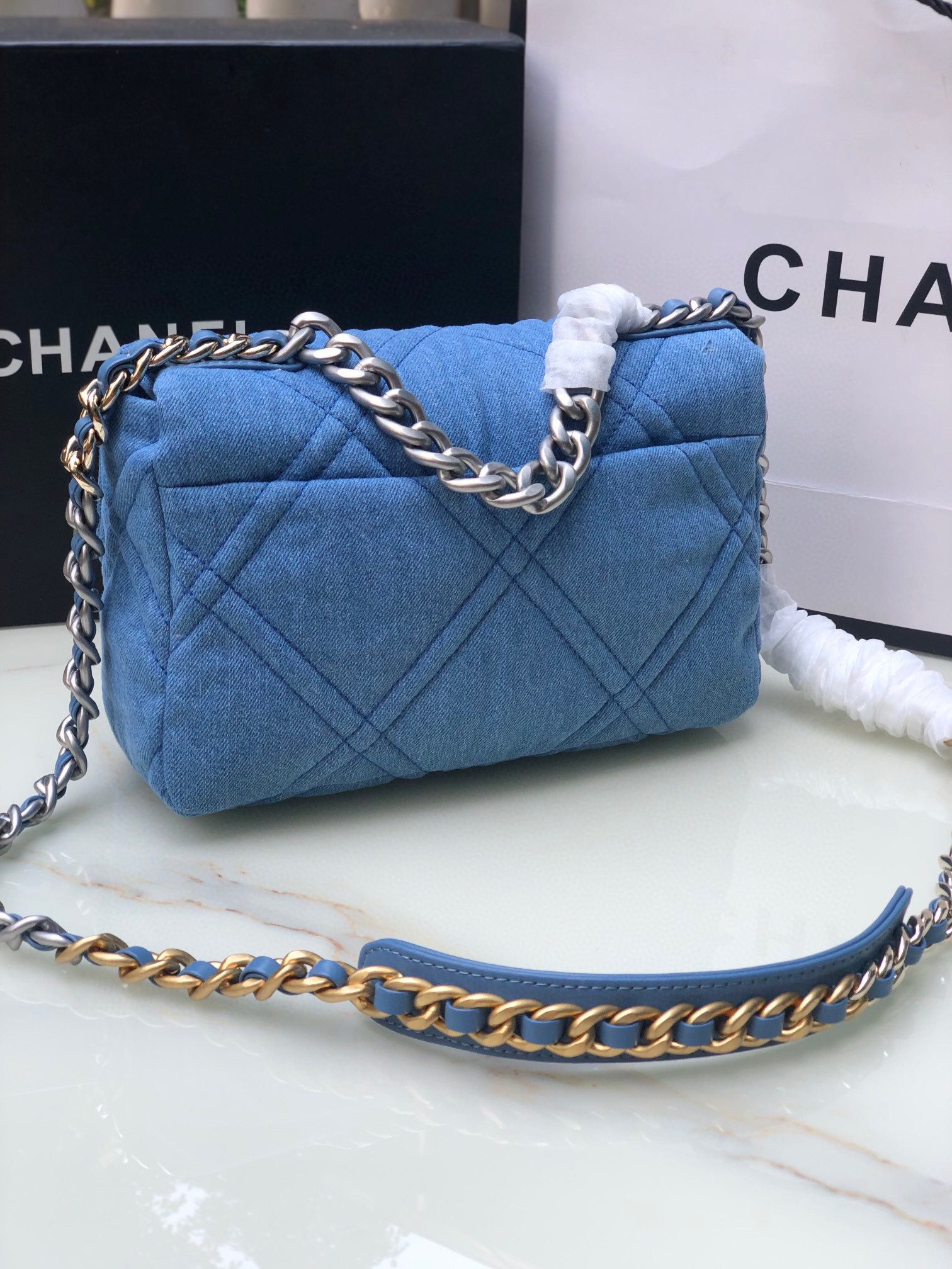 Ch*el 19 handbag, gold-tone, silver-tone & ruthenium-finish metal blue 6.2 × 10.1 × 3.5 in